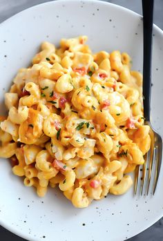 a white plate topped with macaroni and cheese