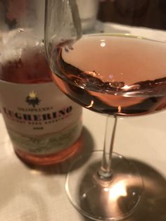 a close up of a wine glass on a table