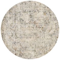 a round rug with an intricate design on the top and bottom, in beige tones