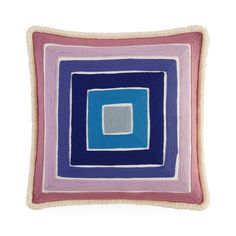 a blue and pink square pillow on a white background