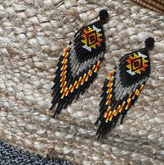 These one-of-a-kind earrings are handmade and woven together with size 11/0 seed beads. Simple dangle flows comfortably when you move and catches attention from others when you wear them! Made in Ecuador by Glida. Attaches to ear with a stud closure.  Please feel free to message me with any questions! Brown Handwoven Beaded Drop Earrings, Traditional Beaded Fringe Drop Earrings, Festival Yellow Handwoven Beaded Earrings, Yellow Handwoven Beaded Earrings For Festivals, Traditional Brown Beaded Earrings With Tiny Beads, Traditional Brown Beaded Fringe Earrings, Handmade Southwestern Dangle Beaded Earrings, Handmade Southwestern Beaded Dangle Earrings, Southwestern Handmade Dangle Beaded Earrings