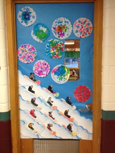 a door decorated with paper plates and snowboarders