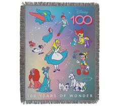 a blanket with cartoon characters on it and the words 100 years of wonder written in front of them