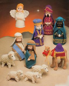 crocheted nativity figurines are displayed on a table