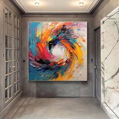 an abstract painting hangs in the hallway