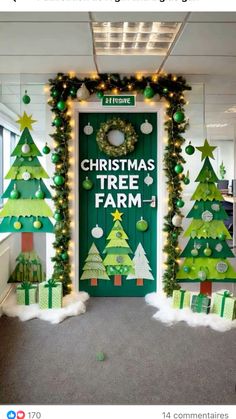 an office decorated for christmas with green trees and presents on the front door that says christmas tree farm