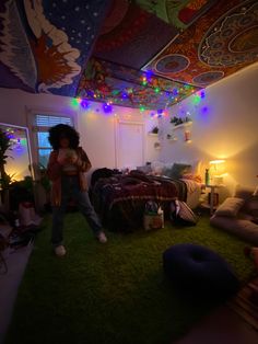 a person standing in a room with lots of lights on the ceiling and green carpet