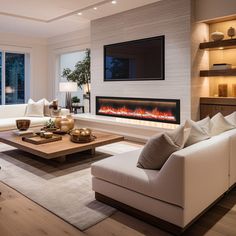 a living room with two couches, a coffee table and a fire place in the fireplace