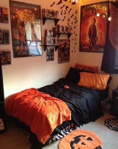 a bedroom with posters on the wall and a bed