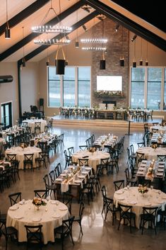 an empty banquet hall with tables and chairs