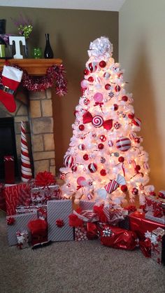 a white christmas tree decorated with candy canes