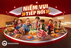 a group of people sitting around a table with food on it and the words nem vui step nox