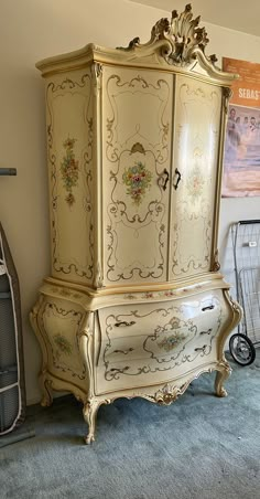 an ornate armoire in the corner of a room