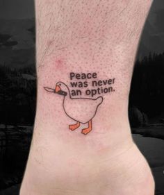 a small tattoo on the ankle that reads peace was never an option and a duck