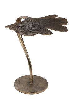 a metal sculpture with a bird on it's back