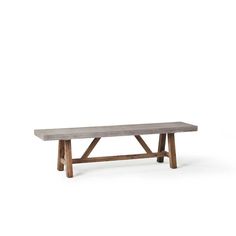 a wooden bench sitting on top of a white floor