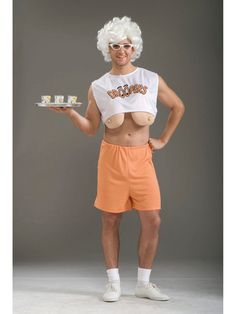 a man in an orange shorts and white shirt holding a tray with food on it