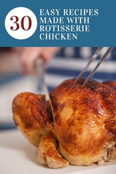 a close up of a person cutting a chicken on a plate