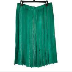 Description: Bottom's Style: Midi Skirt Material: Lamb Leather Color: Green Pleated Side Pockets Zip And Snap Closure At Side Condition: This Is An Used Item In Excellent Condition. No Visible Signs Of Wear. Measurements: Waist 32" Length 27.5" Elegant Green Skirt With Accordion Pleats, Spring Silk Skirt With Accordion Pleats, Elegant Green Accordion Pleats Skirt, Green Knee-length Skirt For Formal Occasions, Summer Formal Silk Pleated Skirt, Formal Summer Silk Pleated Skirt, Green Flowy Formal Skirt, Green Formal Midi Skirt, Formal Green Flowy Skirt