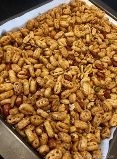 a tray filled with nuts sitting on top of a counter