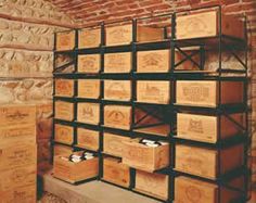 the shelves are filled with wooden boxes