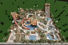 an aerial view of a water park in the middle of a green area with palm trees