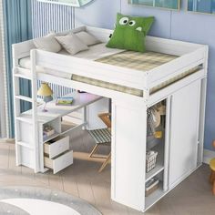 a child's bed with a desk underneath it and a stuffed animal on top