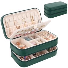 an open green case filled with lots of jewelry