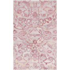 a pink rug with an ornate design on it