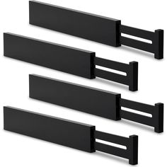 three black plastic shelf brackets on a white background