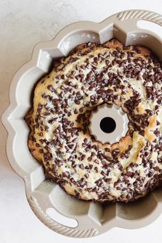 a donut with chocolate sprinkles in a bundt cake pan