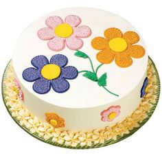 a cake decorated with flowers on a plate