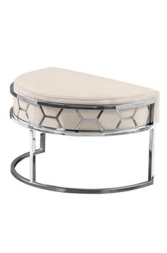 a white ottoman with chrome frame and cushion