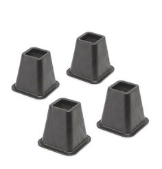 four black plastic cup holders on a white background