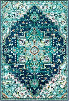 a blue and green rug with an ornate design