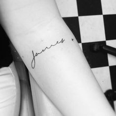 a person with a tattoo on their arm that reads, janes and is written in cursive font