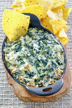 spinach dip with tortilla chips on the side