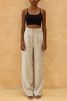 The tie front wide leg pants offer a relaxed fit with an adjustable waist for effortless style. Handcrafted in our studio to your measurements and preferences, available in over 60 colors. DETAILS - 100 % linen, medium weight (200gsm), free-shrinkage, amazingly soft feel - Floor length pants; different length is possible - High waisted - Wide-legs - Front zipper with detachable ties - Inseam pockets - Custom made pants, FREE customizations; simply let us know your needs (hem length, fit style, leg opening width, belt, etc.). - Handcrafted in our studio, French seams, clean and meticulous COLOR - The color shown is Cream. - Available in over 60 colors, choose color in the color chart in the listing. - Link of fabric samples available here: https://madebygaiavn.etsy.com/listing/1399149538 - Wide Leg Linen Pants With Tie Waist, Linen Trousers With Tie Waist, Linen Bottoms With Tie Waist And Straight Leg, Linen Bottoms With Tie Waist, Linen Straight Pants With Tie Waist, Beige Linen High-waist Wide Leg Pants, Relaxed Fit Linen Bottoms With Tie Waist, High Waist Linen Pants With Relaxed Fit, Linen Bottoms With Tie Waist And Relaxed Fit