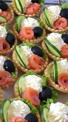 many different types of food are arranged on the table for display or to be eaten