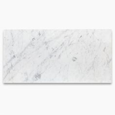 a white marble tile with grey veining