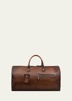 "Find BERLUTI Jour Off Leather Travel Bag, L on Editorialist. Berluti \"Jour Off\" travel duffel bag in premium leather features address tag and padlock Approx. 18.5\"L x 11.8\"W Double zip closure Two rolled top carry handles Debossed logo lettering at front Exterior front zip pocket One interior zip pocket Detachable crossbody strap Calf leather/stainless steel/brass Made in Italy" Travel Duffel Bag, Debossed Logo, Leather Travel Bag, Travel Duffel, Duffel Bag Travel, Leather Travel, Letter Logo, Duffel Bag, Crossbody Strap