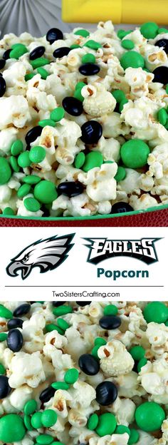 a close up of a cake with green and black candies on the top, and an eagles popcorn in the middle