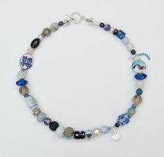 This exquisite blue and white necklace features a harmonious blend of vibrant beads and charming accents, creating a stunning accessory that enhances any outfit. The intricate design showcases a variety of textures and shapes, making it a versatile piece suitable for both casual and formal occasions. Crafted with attention to detail, this necklace not only adds a pop of color but also reflects a sense of elegance and style. Perfect for gifting or personal adornment, it is a must-have addition to any jewelry collection. Blue And White Necklace, White Beaded Necklace, Hues Of Blue, Blue Beaded Necklace, Necklace Elegant, White Necklace, Perfect Gift For Her, Intricate Design, Showcase Design