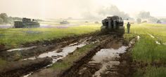 an army vehicle driving down a muddy road in the middle of a field with two men standing next to it