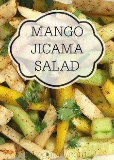 a close up of food with the words mango jicama salad in it's center