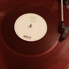 an old record player is sitting on top of a red turntable that has the word for do i am written on it