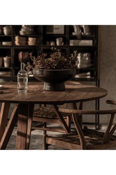 a wooden table with two chairs around it