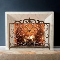 a fireplace with an ornate design on the mantle