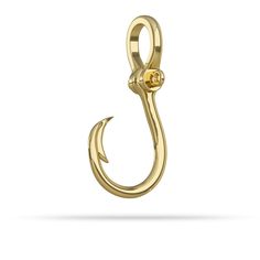 a gold fishing hook on a white background