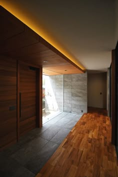 an empty room with wooden floors and walls